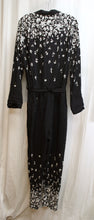 Load image into Gallery viewer, Lilka (Anthropologie) - Soft Black w/ Floral On Legs and Shoulders/Arms Lightweight Tie Waist Jumpsuit - Size M